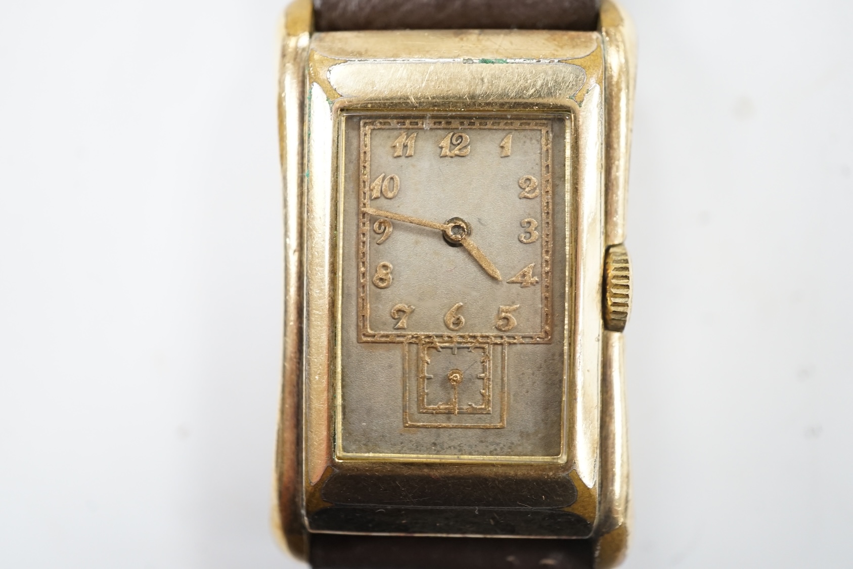 A gentleman's vintage Gruen 'Prince-style' wrist watch, in gilt case engraved 'Rolex 14k gold filled', with silvered dial, raised gilt arabic numerals and subsidiary seconds. The movement with the original Gruen naming d